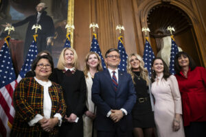 House Speaker Mike Johnson poses with former collegiate swimmer Riley Gaines and advocates after the House passed the Protection of Women and Girls in Sports Act at the U.S. Capitol on January 14, 2025. | Photo by Francis Chung/POLITICO